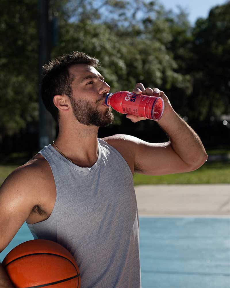 Basketball Player on court drinking Fruit Punch GoodSport.