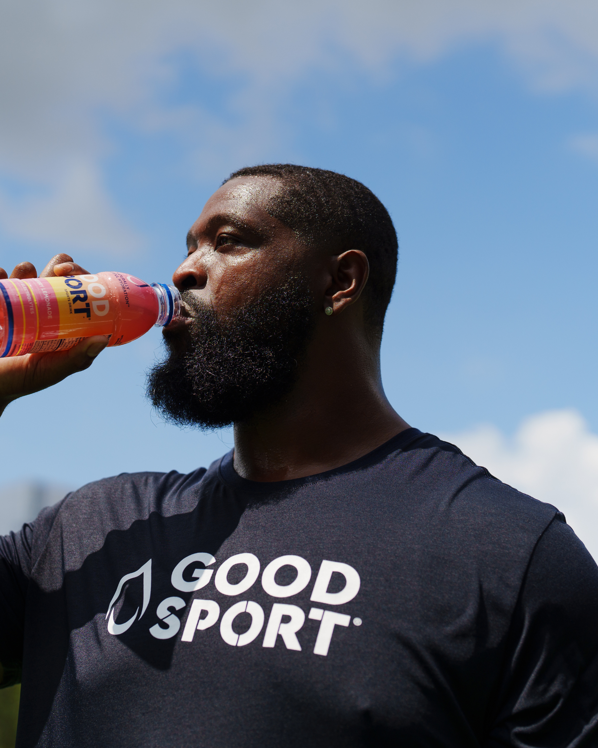 Pro Football Player Terron Armstead drinking a bottle of GoodSport