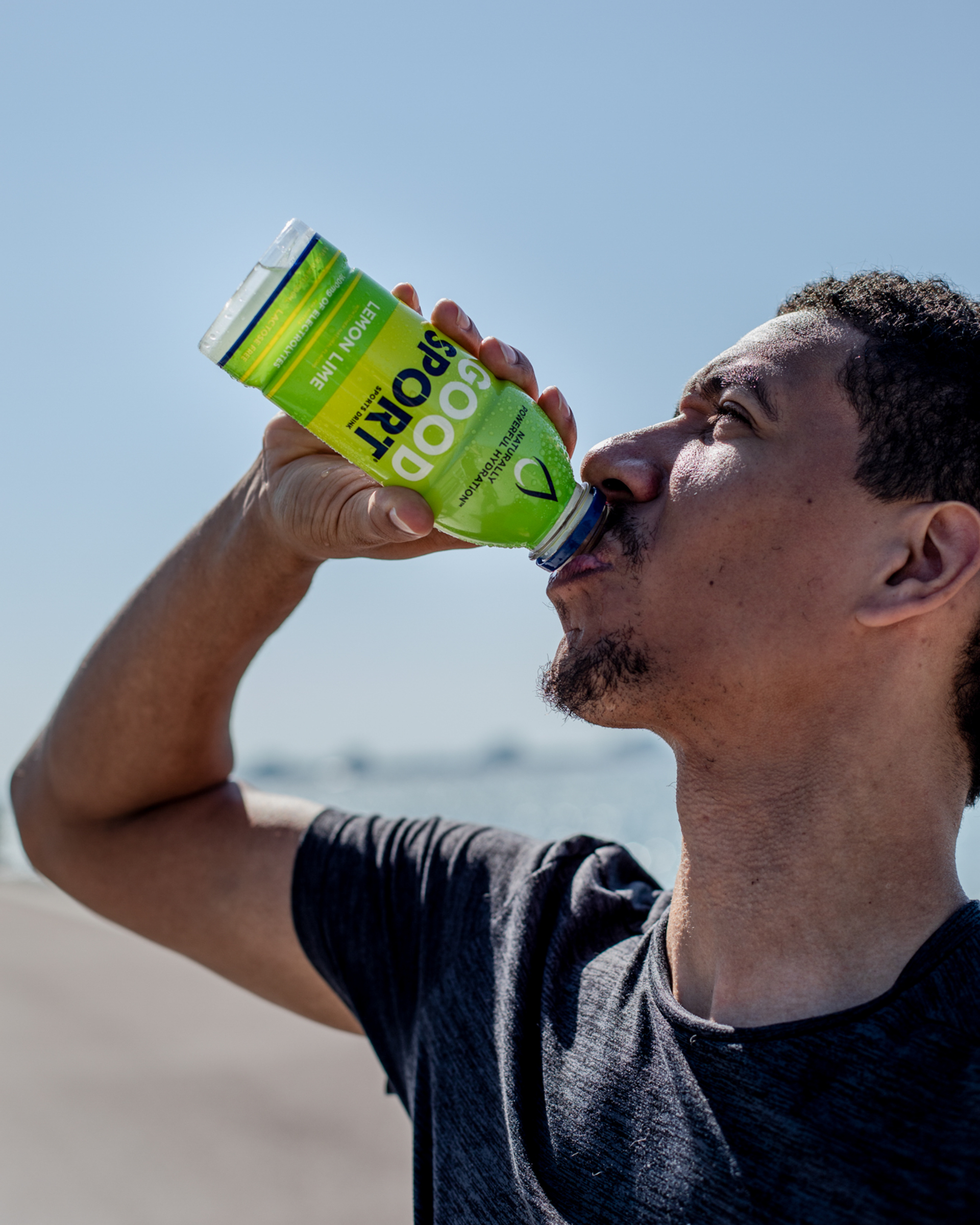 Runner drinking a bottle of GoodSport