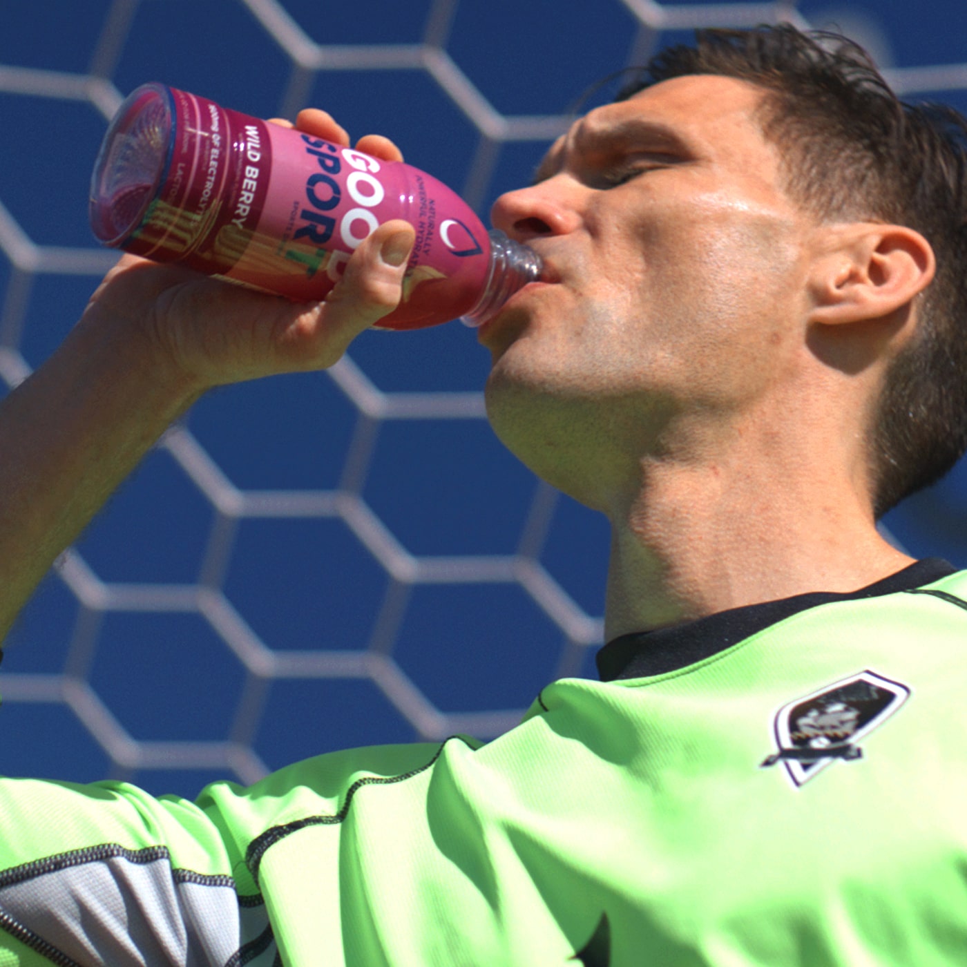 Soccer athlete drinking GoodSport sports drink