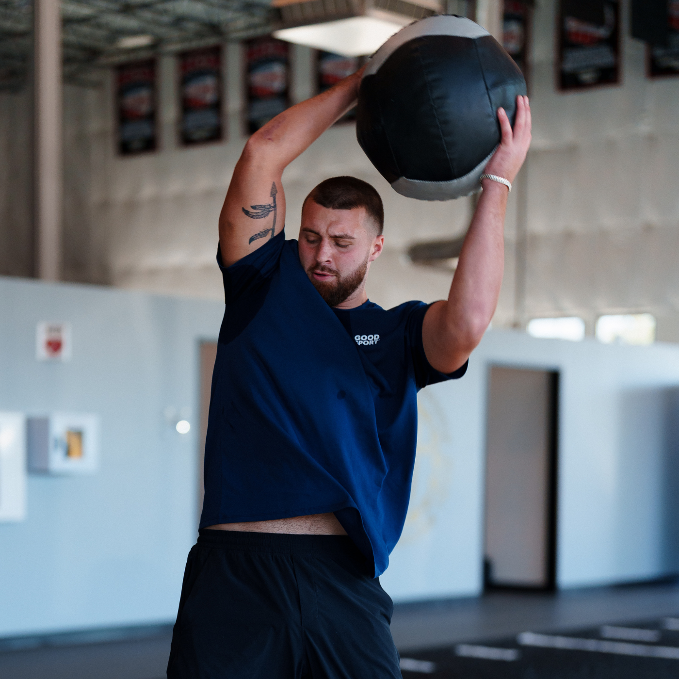 Jake Ferguson throwing weighted ball during workout 